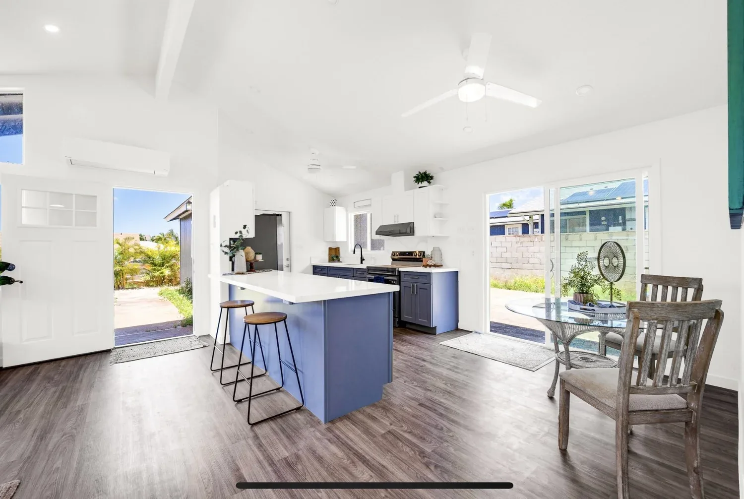 Open kitchen and living area with blue island
